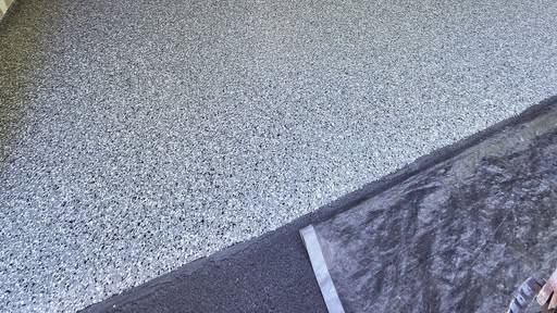 Finished residential epoxy garage floor, close-up finish